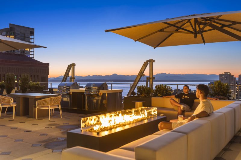 Outdoor terraces with fire pits, lounge chairs, BBQs and sweeping views of Elliott Bay